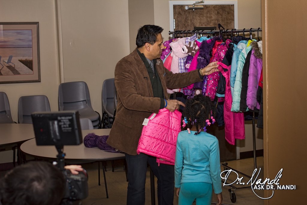 Dr. Nandi Shops Coats with Families