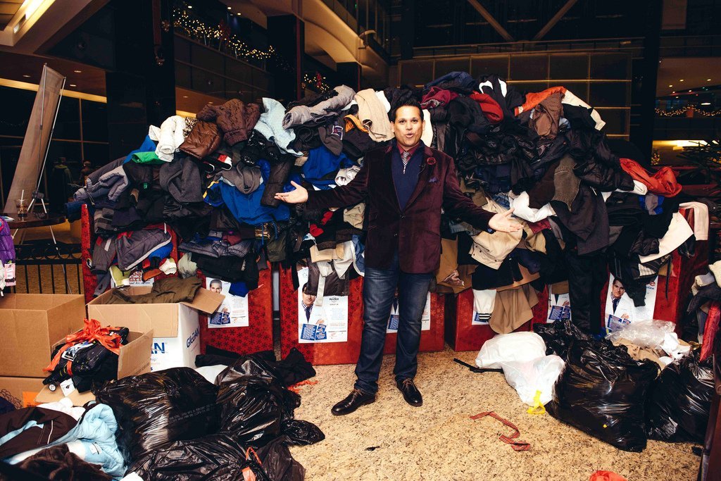 Dr. Nandi with a pile of coats